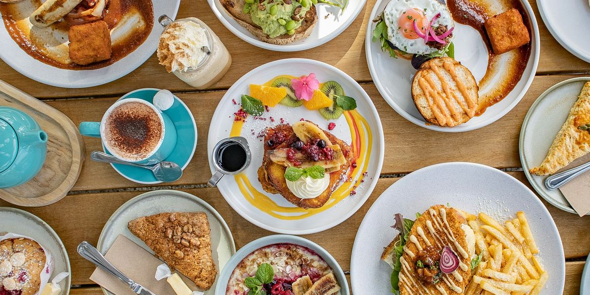 A spread of brunch dishes on a New Zealand cafe table
