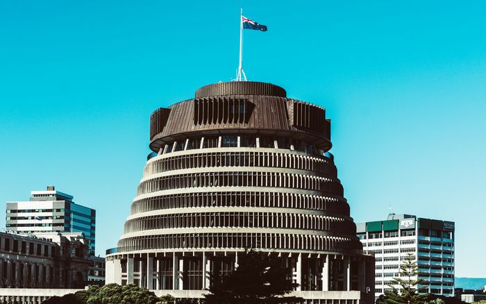 The Beehive parliament building in Wellington under a blue sky