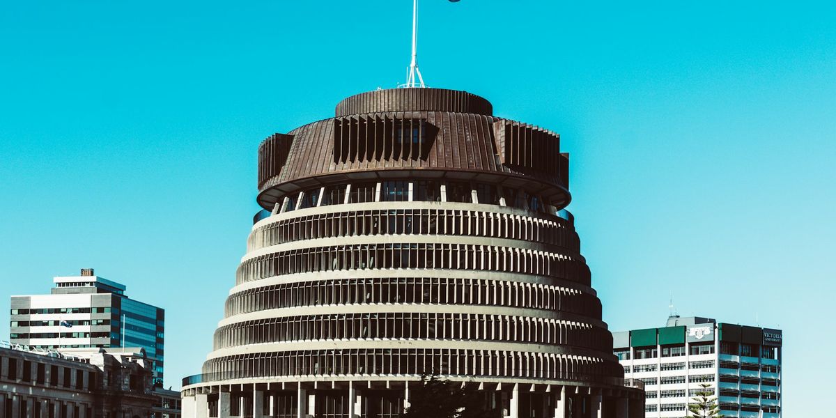 The Beehive parliament building in Wellington under a blue sky