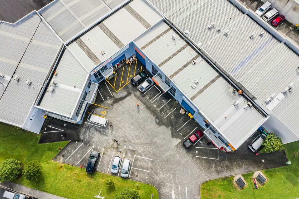 Aerial view of an office and warehouse complex in Rosedale, Auckland
